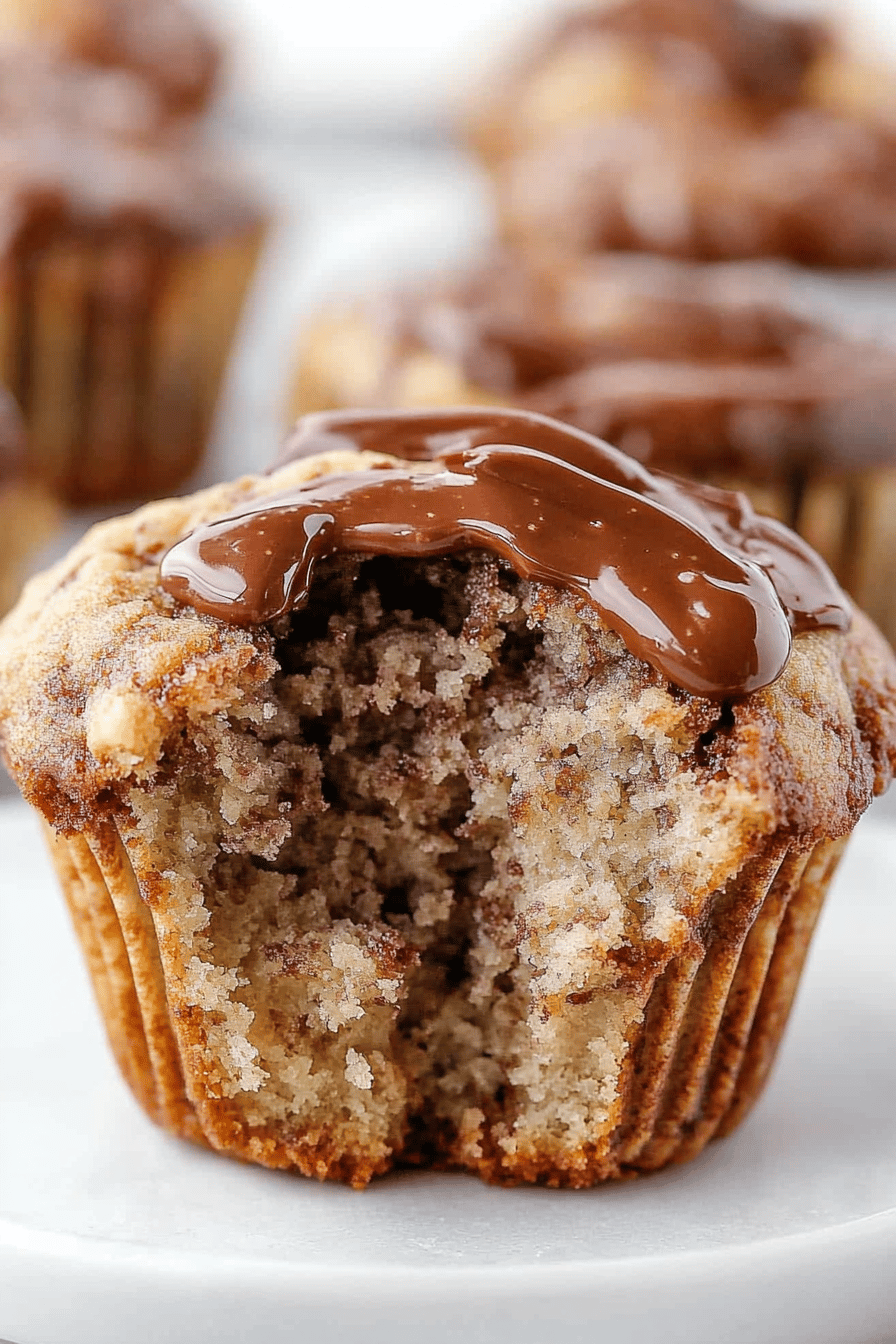 Nutella Banana Muffins slice on plate showing perfect texture and swirl pattern