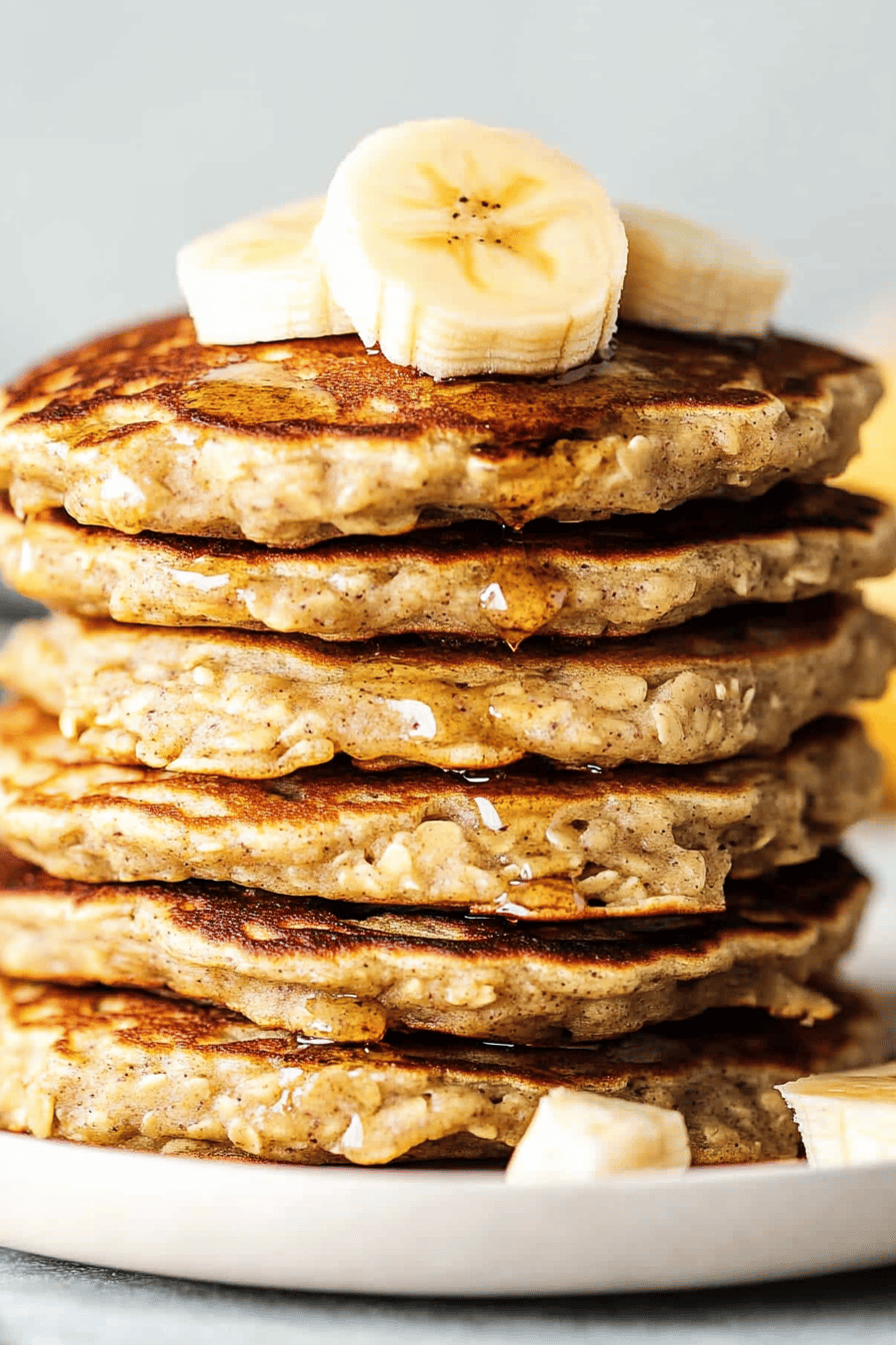 Banana oatmeal pancakes ingredients organized and measured on kitchen counter