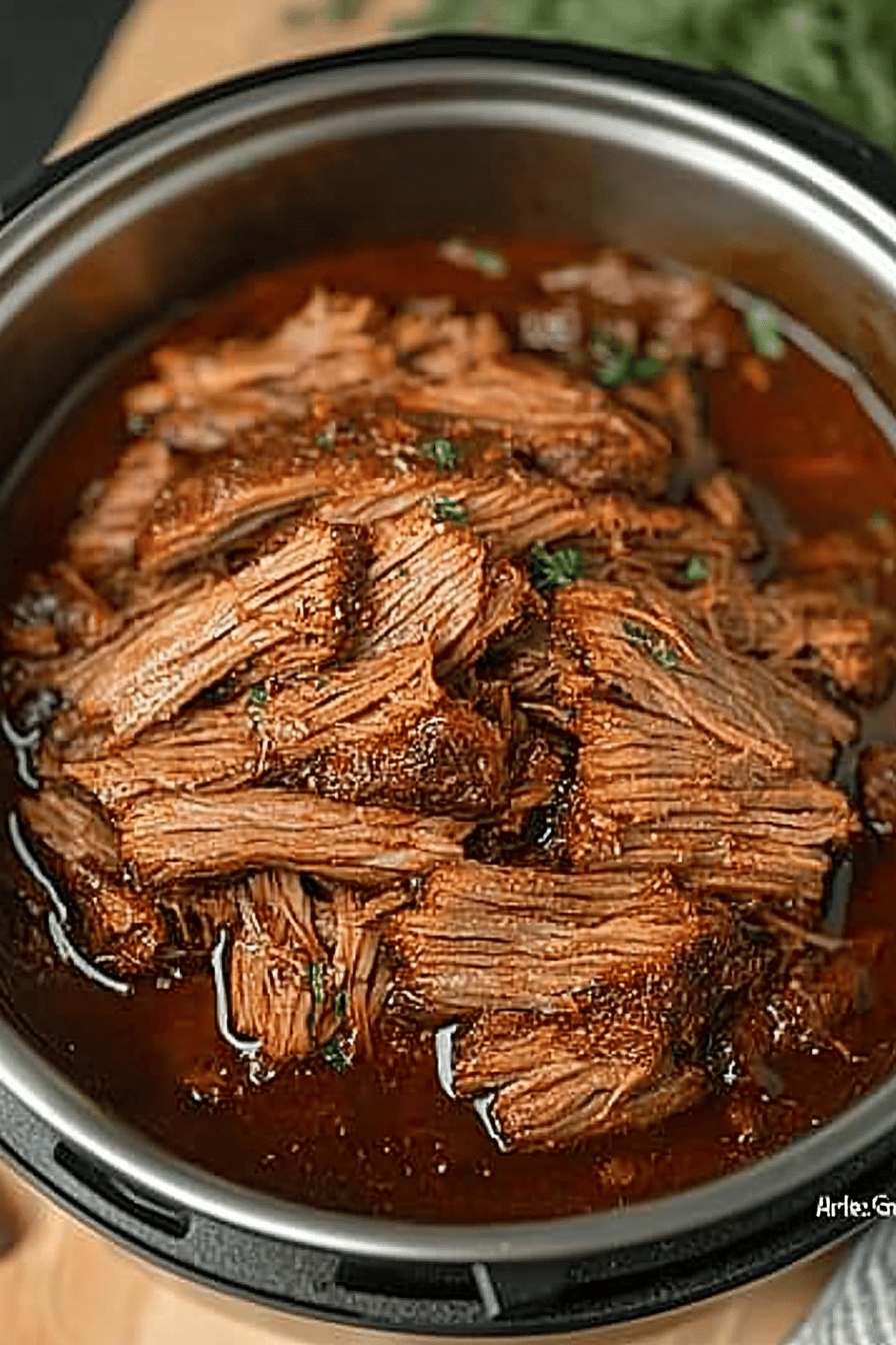 Instant Pot BBQ Brisket slice on plate showing perfect texture and swirl pattern