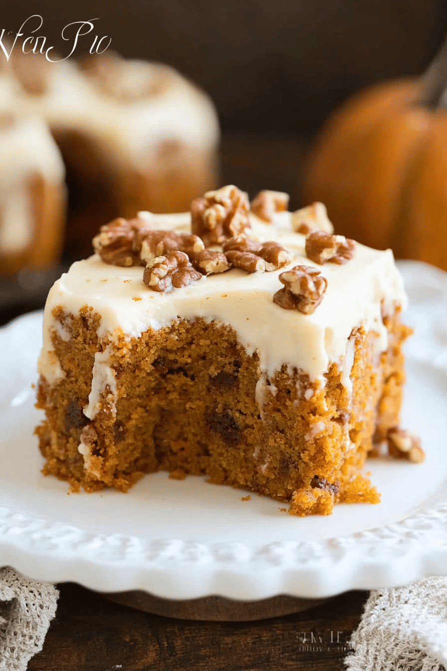 Pumpkin cake slice on plate showing perfect texture and swirl pattern