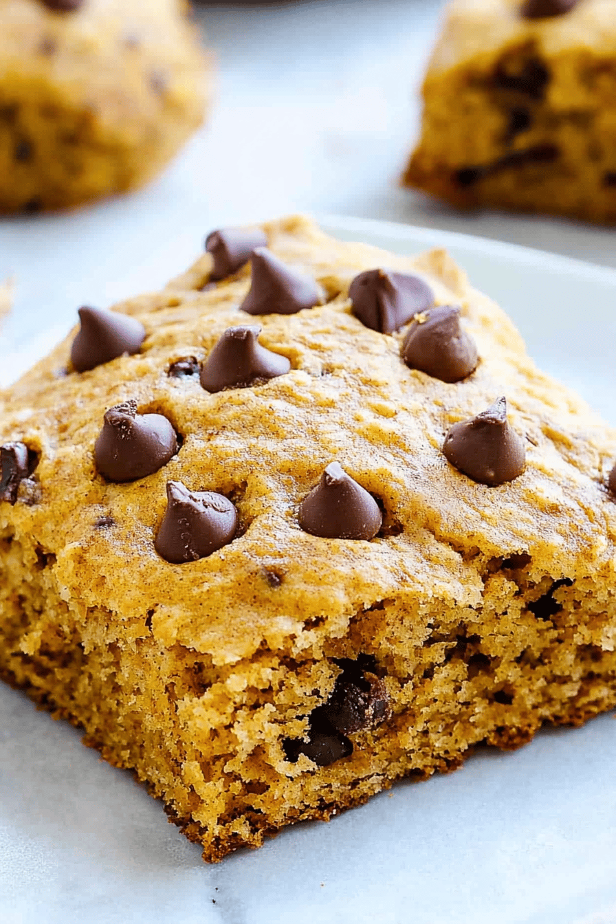 pumpkin scones slice on plate showing perfect texture and swirl pattern