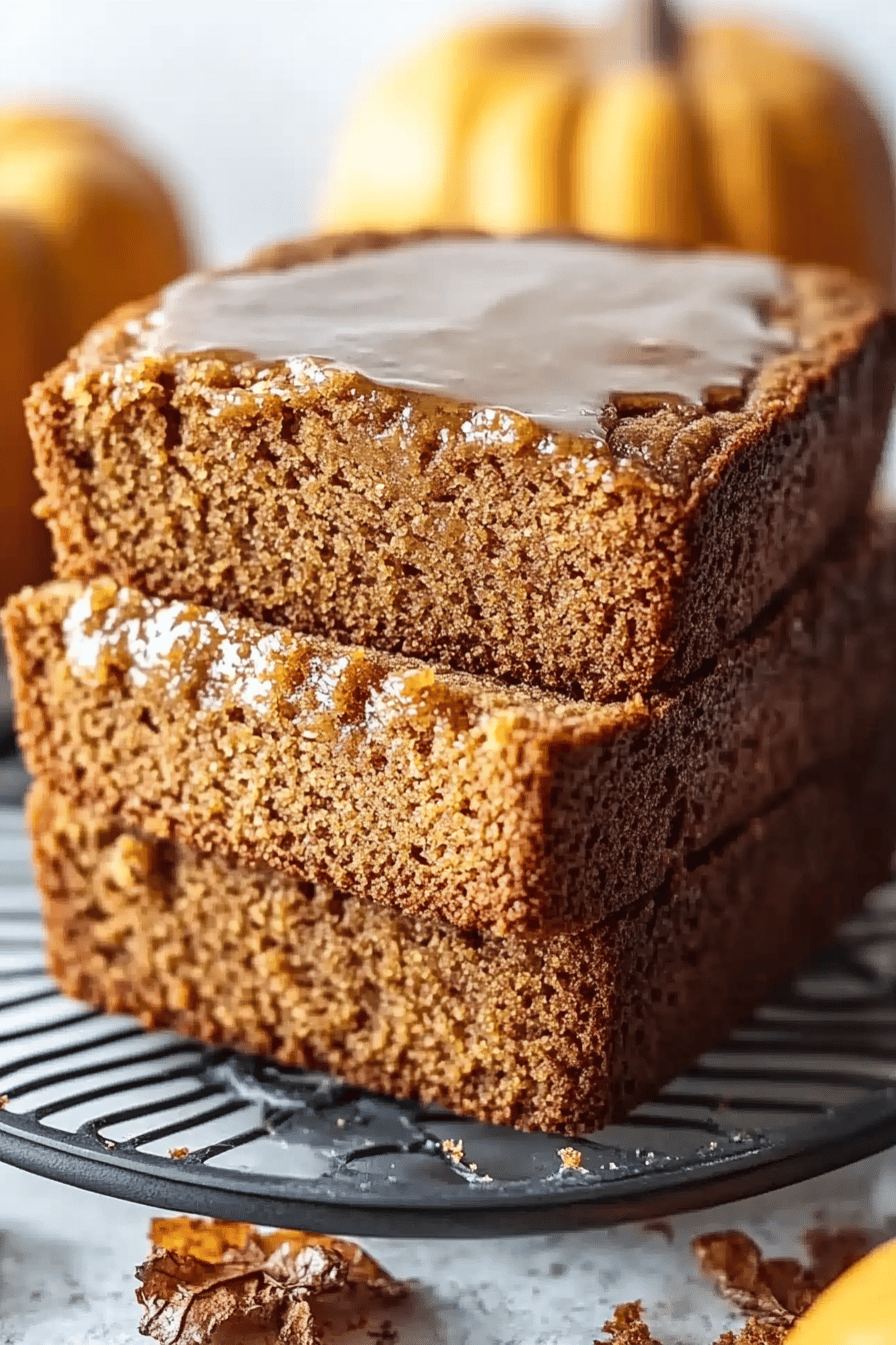 Pumpkin bread slice on plate showing perfect texture and swirl pattern