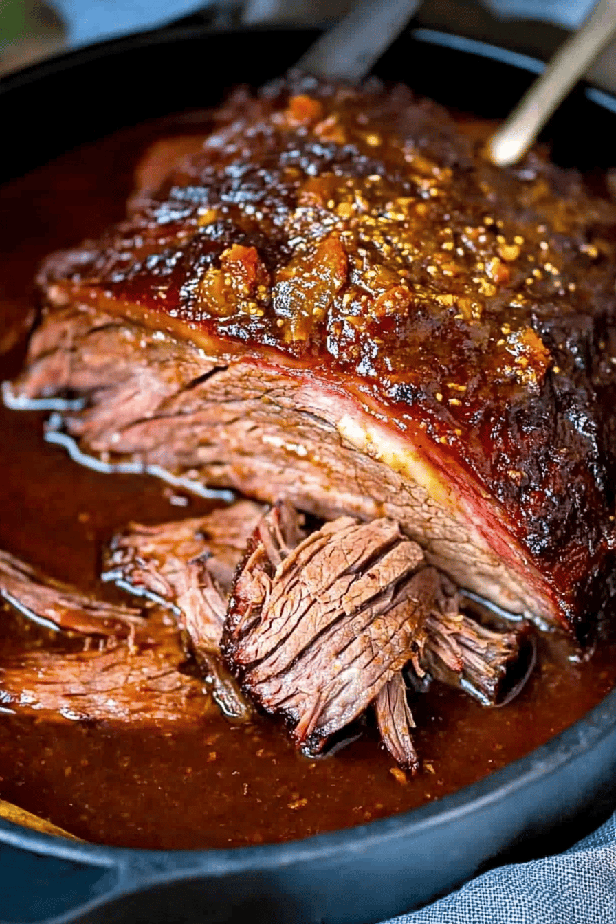 beef brisket slice on plate showing perfect texture and swirl pattern